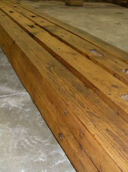 Camp Barn Restoration / Cannon Salvage workers cleaning, applying borate, and waxing the frame.